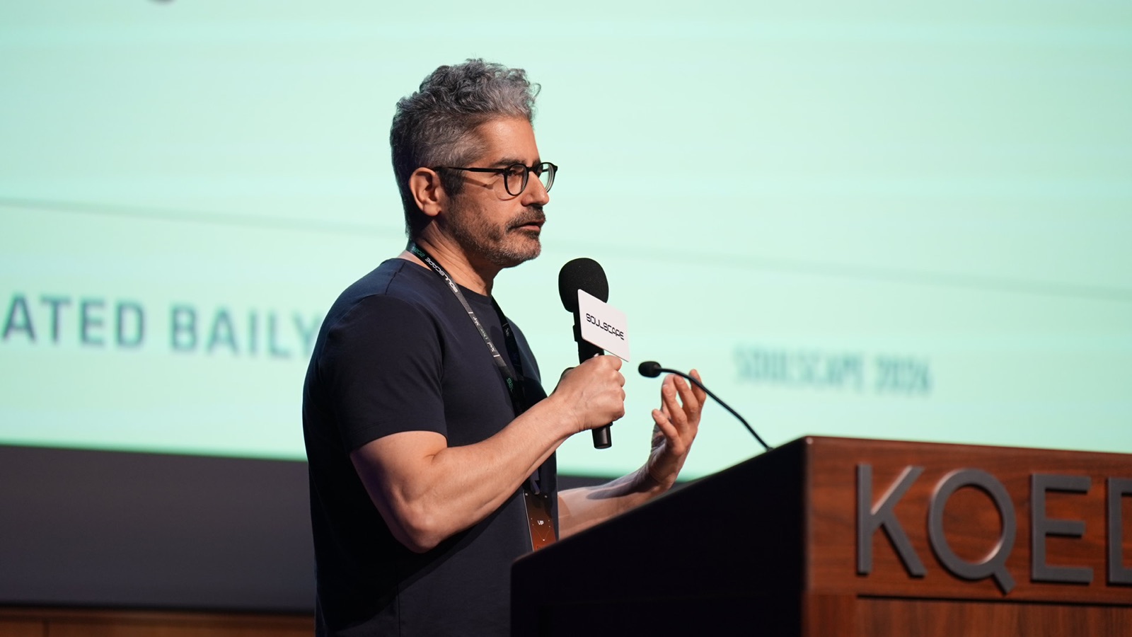 A speaker presenting at the KQED podium during Soulscape 2026
