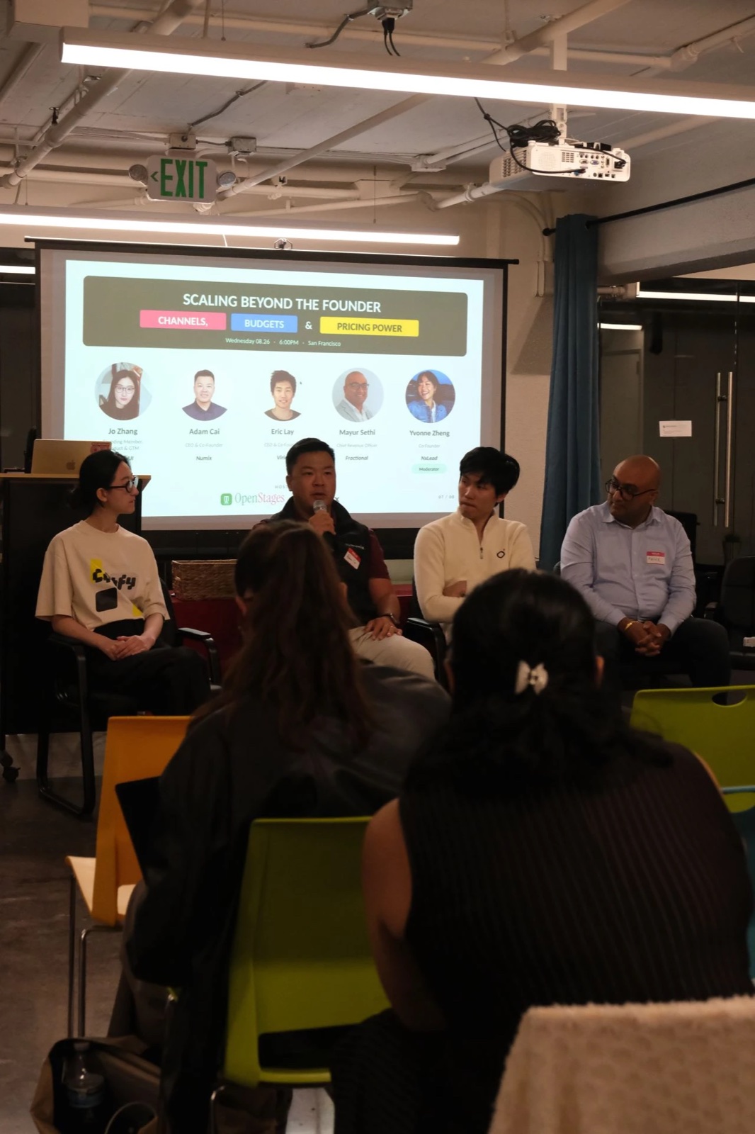 Adam Cai speaking on the Scaling Beyond the Founder panel, with the channels, budgets, and pricing power title slide behind the speakers