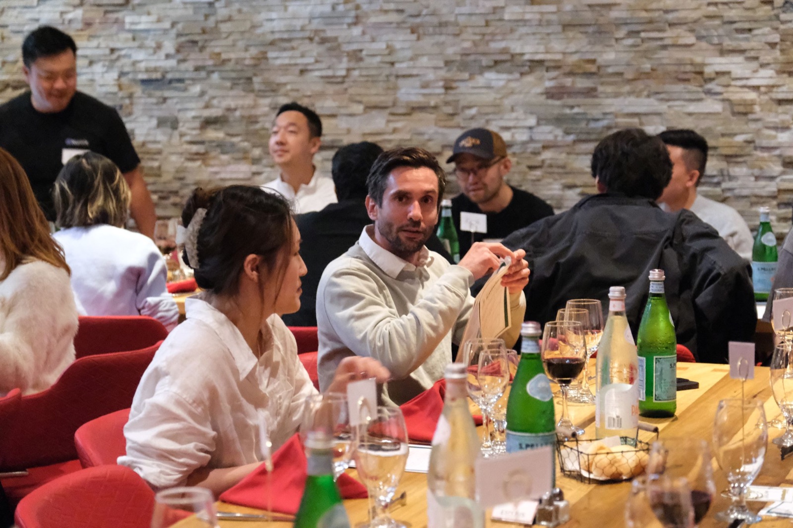 Bay Area founders exchanging ideas over dinner at a private restaurant table